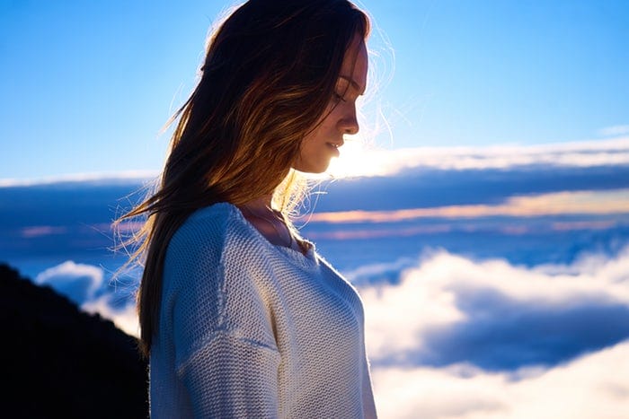 Woman looking into infinity and finding peace within
