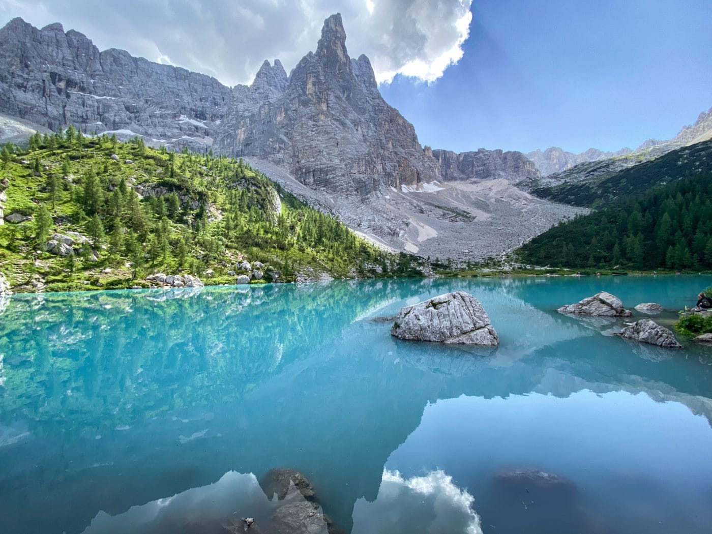 Lago Sorapis an alpine lake in the Dolomites Italy with monumental mountain peak in the background called "dito di dio"