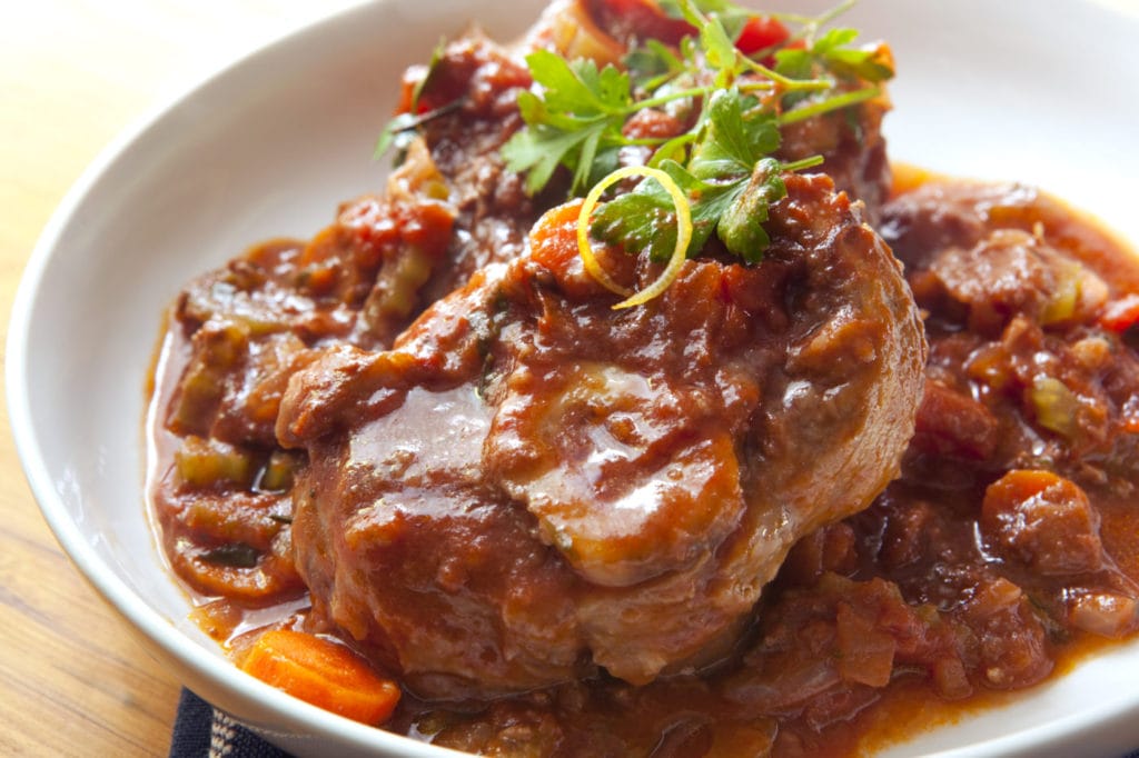 Classic osso buco. Veal shanks slow cooked with tomatoes, carrots and onion. Hearty, warming food.
