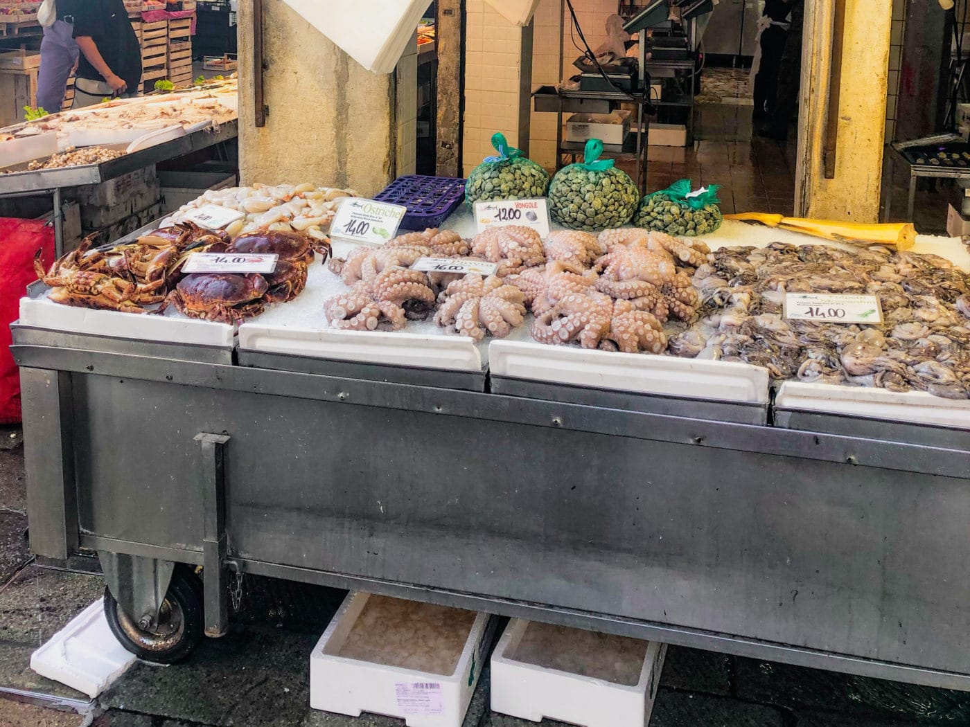 a typical stand selling octopus and crab at the Rialto Fish Market in Venice Italy