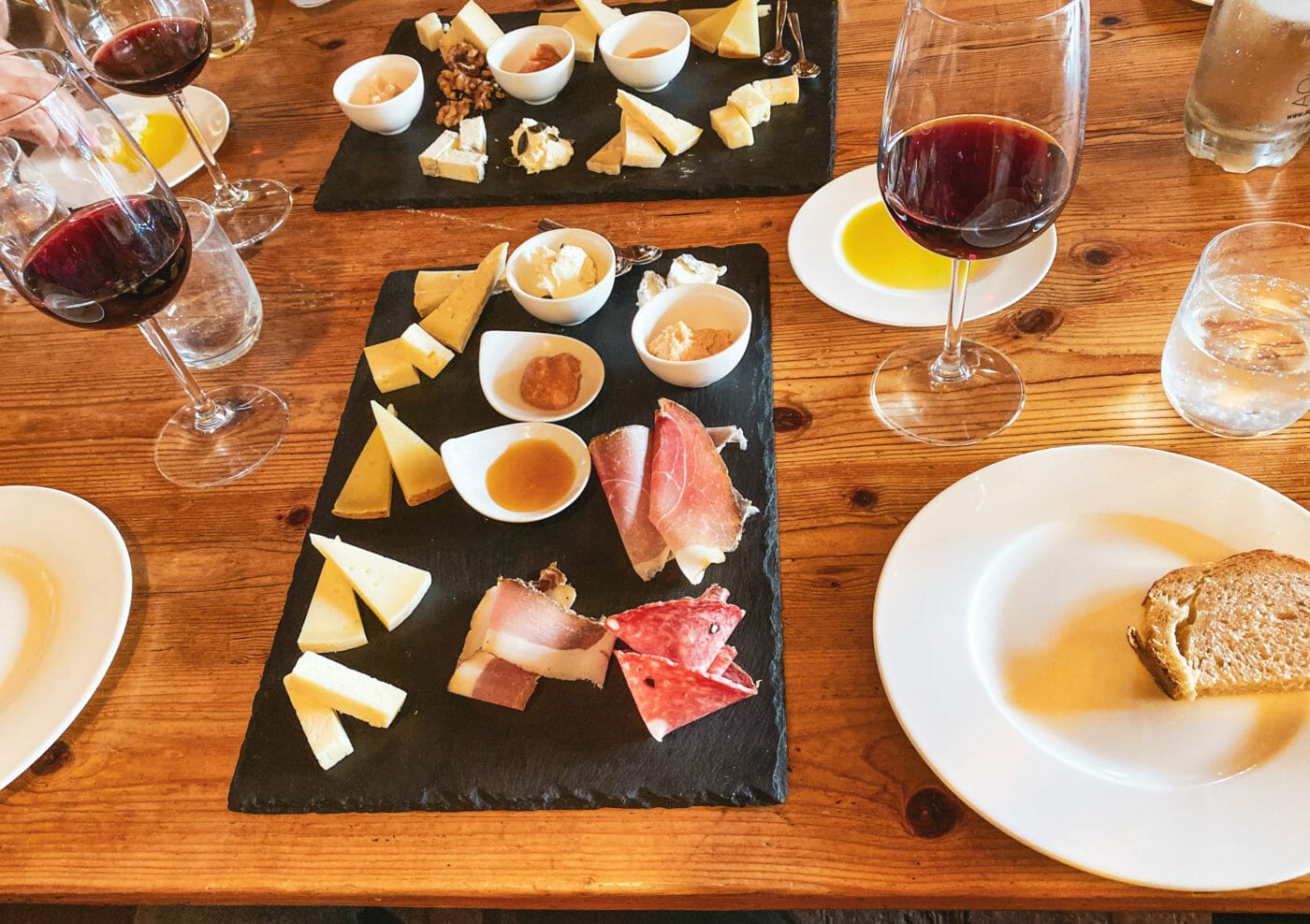 cheese and cold cuts on a platter during a wine tasting