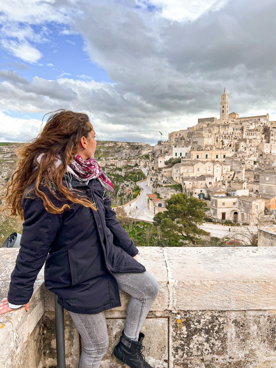 woman overlooking the city of Matera at a panorama point