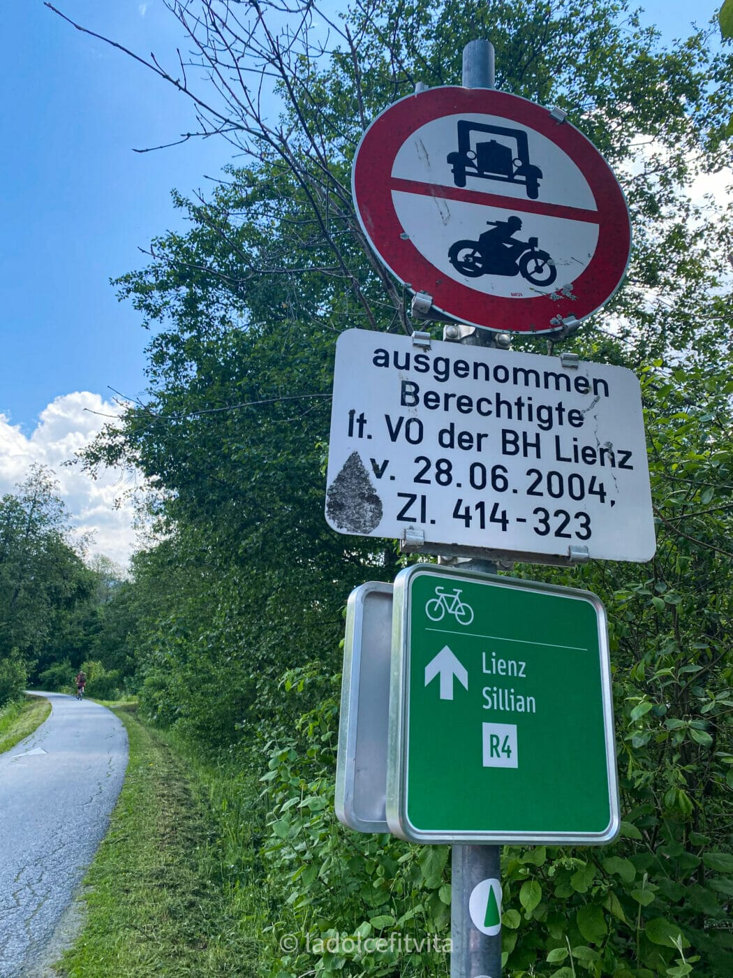 Bike Path in the Dolomites - trail signs along the San Candido-Lienz cycling route