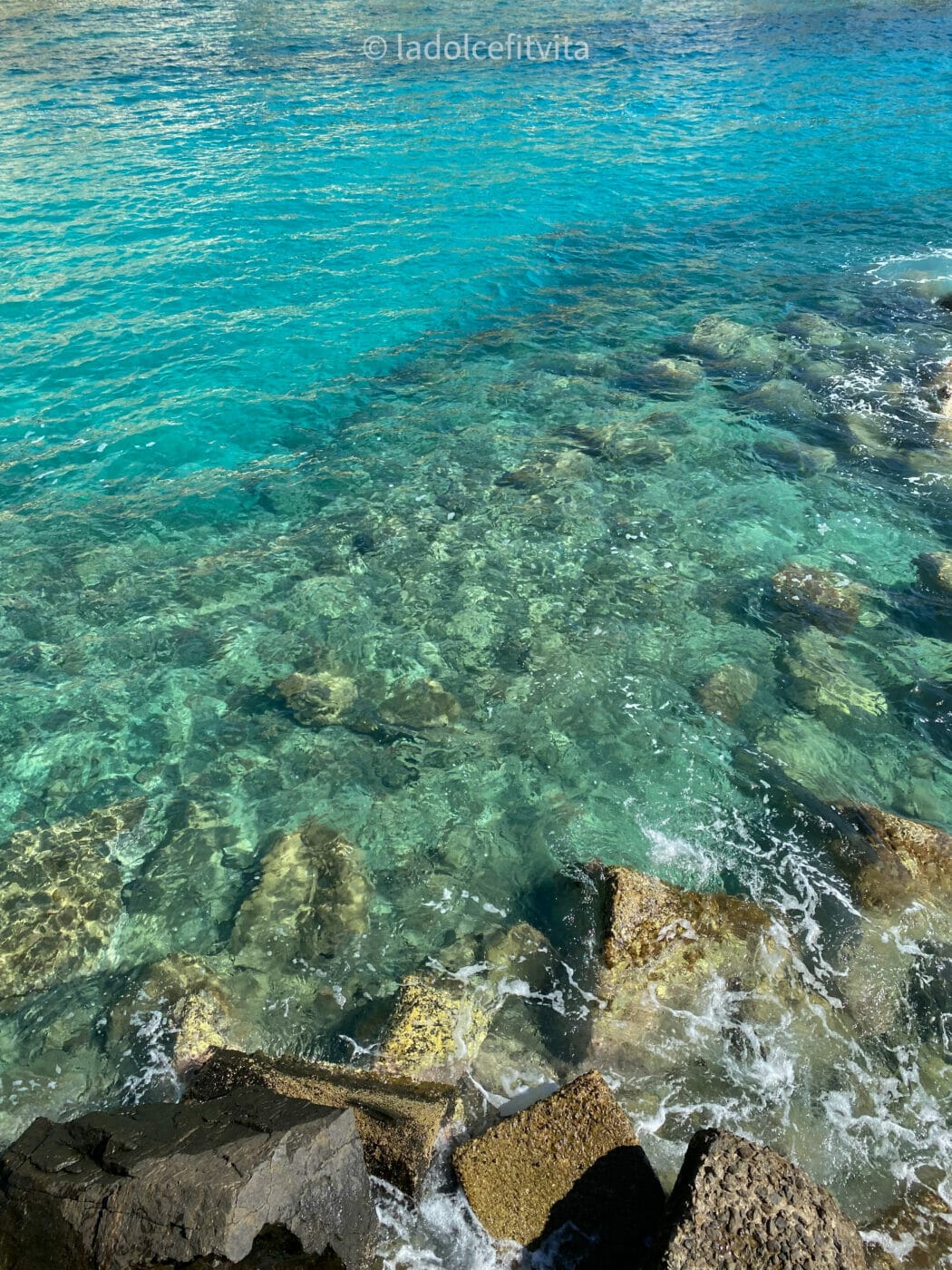 turquoise sparkling water of the Tyrrhenian Sea as seen from the beach in Pizzo Calabria