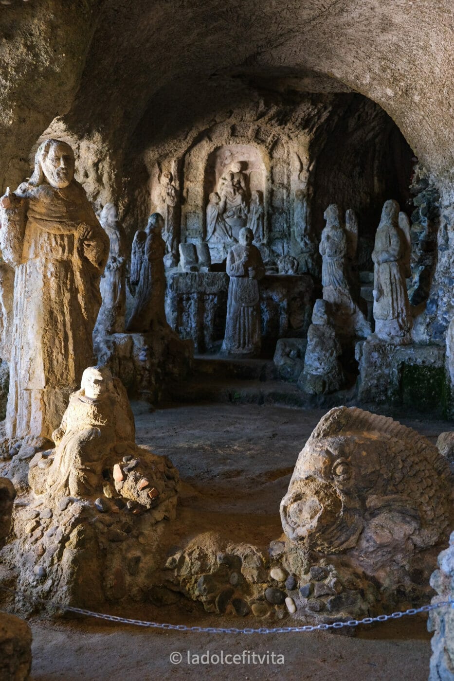 sacred statues carved from stone in the Piedigrotta chuch in Pizzo Calabria, Italy