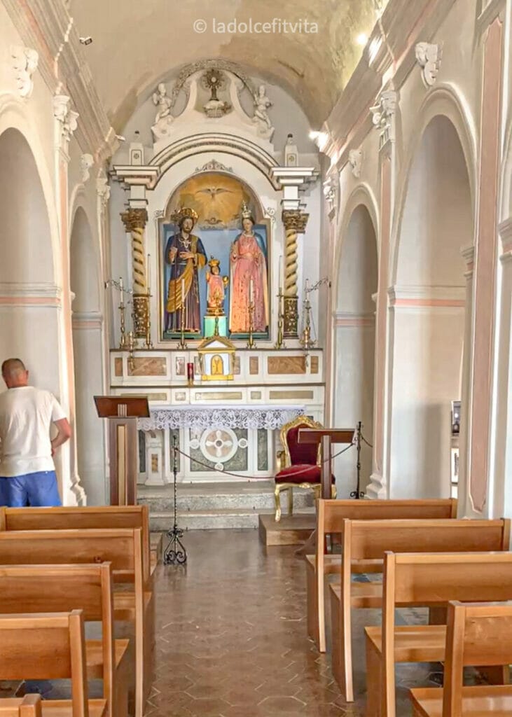 the altar and pews inside the church of santa maria dell'isola in tropea italy