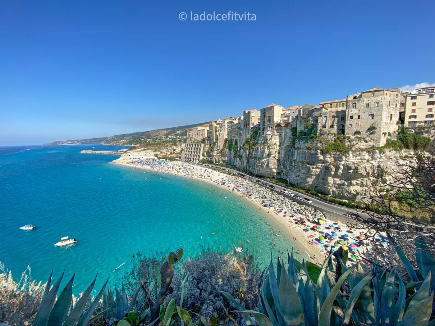 Bird's eye view of the turquoise shores of Tropea and its Rotonda beach